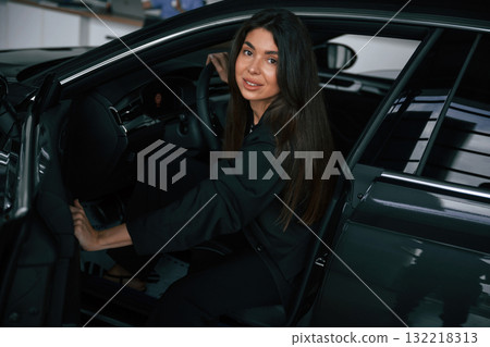 Beautiful businesswoman is in the new car 132218313