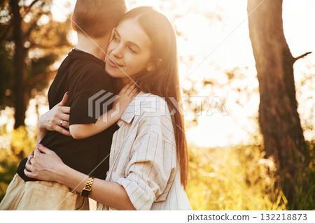 In the forest. Mother and son are together In the forest. Mother and son are together 132218873