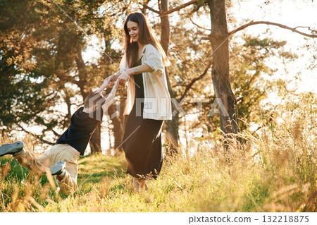 Having fun. Mother and son are in the forest together 132218875