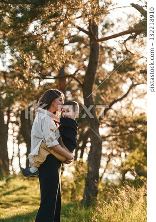 Fun times. Mother and son are in the forest together 132218910