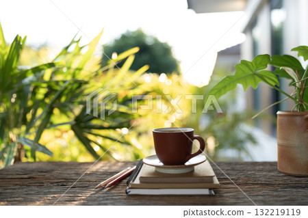 Brown coffee and kraft paper notebooks on a table 132219119