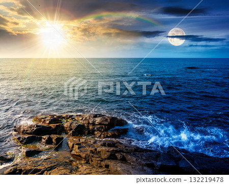 sea coast with rocks and boulders. day and night time change concept. calm summer vacation background at the seashore. wonderful scene for relax and leisure at the seaside with sun and moon sea coast with rocks and boulders. day and night time change concept. calm summer vacation background at the seashore. wonderful scene for relax and leisure at the seaside with sun and moon 132219478