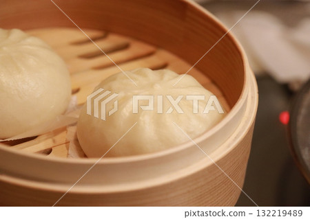 Frozen steamed meat buns in a steamer Frozen steamed meat buns in a steamer 132219489