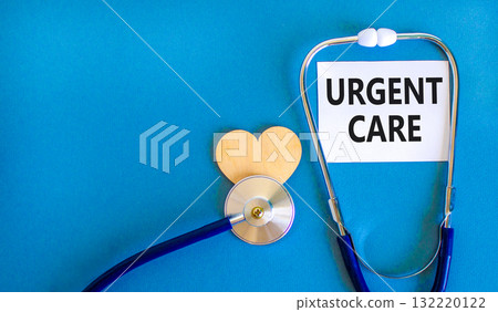 Urgent care symbol. Concept words Urgent care on beautiful white card. Wooden heart and stethoscope. Beautiful blue background. Medical healthy lifestyle urgent care concept. Urgent care symbol. Concept words Urgent care on beautiful white card. Wooden heart and stethoscope. Beautiful blue background. Medical healthy lifestyle urgent care concept. 132220122