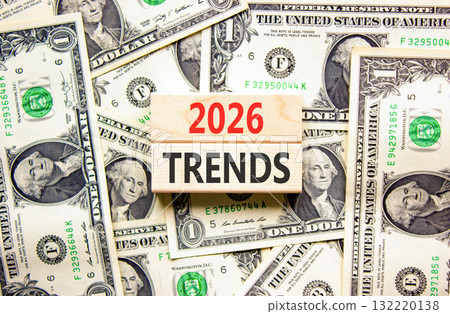 2026 Trends new year symbol. Concept words 2026 Trends on beautiful wooden blocks. Beautiful dollar bills background. Dollar bills. Business and 2026 Trends new year concept. Copy space. 2026 Trends new year symbol. Concept words 2026 Trends on beautiful wooden blocks. Beautiful dollar bills background. Dollar bills. Business and 2026 Trends new year concept. Copy space. 132220138
