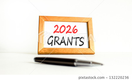 2026 Grants symbol. Concept words 2026 Grants on beautiful wooden picture frame. Beautiful white paper background. Beautiful black pen. Business and 2026 grants concept. Copy space. 2026 Grants symbol. Concept words 2026 Grants on beautiful wooden picture frame. Beautiful white paper background. Beautiful black pen. Business and 2026 grants concept. Copy space. 132220236