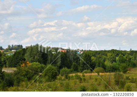 Rural houses surrounded by trees in summer, Lipetsk region, Russia Rural houses surrounded by trees in summer, Lipetsk region, Russia 132220850