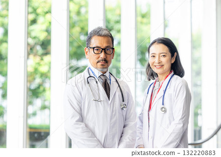 Senior male and female doctors Senior male and female doctors 132220883
