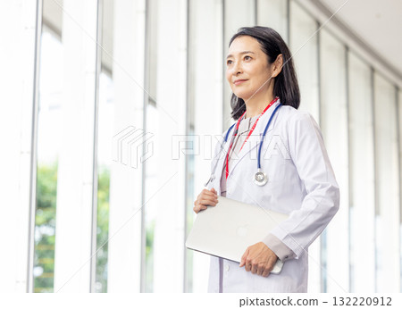 Senior female doctor working at the hospital 132220912