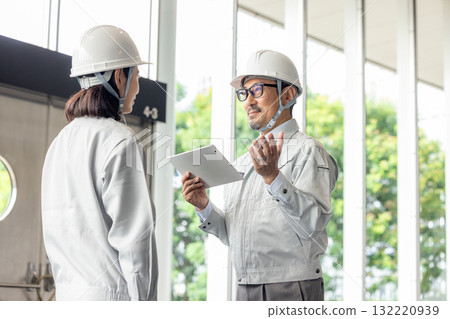 Having a meeting while looking at a tablet Having a meeting while looking at a tablet 132220939