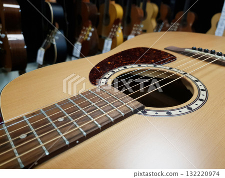 Acoustic guitars at a music store Acoustic guitars at a music store 132220974