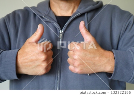 Man showing double thumbs up gesture Man showing double thumbs up gesture 132222196