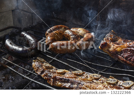 Barbecue, grilled sausages and cow meat , traditional argentine cuisine Barbecue, grilled sausages and cow meat , traditional argentine cuisine 132222366