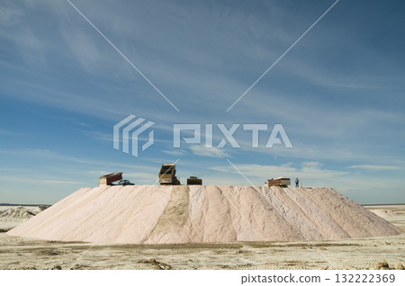 Trucks unloading raw salt bulk, Salinas Grandes de Hidalgo, La Pampa, Argentina. 132222369