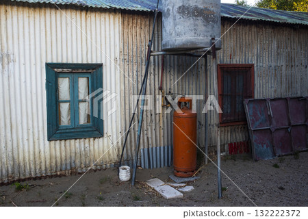 Picturesque typical construction in the town of Puerto Piramides, Peninsula Valdes, Chubut Province, Patagonia, Argentina. 132222372