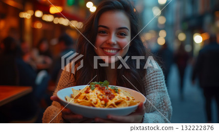 Smiling Woman Enjoying Nachos at Outdoor Restaurant 132222876