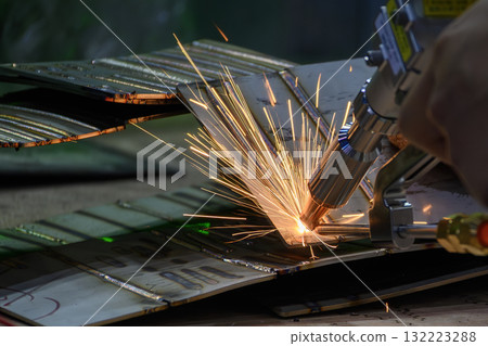 Close up scene the laser welding process by hand held laser welding machine. 132223288