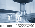 The CNC milling machine rough cutting the aluminum parts by face mill tools in the light blue scene 132223290