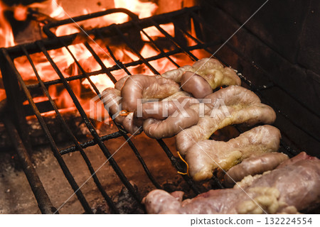 Cow bowels presented on a grill. Argentine Traditional cuisine. 132224554