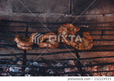 Cow bowels presented on a grill. Argentine Traditional cuisine. 132224555
