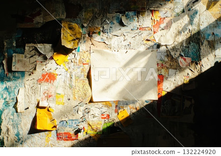 Captivating Urban Texture with Colorful Layers of Torn Paper on Wall Illuminated by Sunlight, Empty White Space Ready for Your Creative Touch Captivating Urban Texture with Colorful Layers of Torn Paper on Wall Illuminated by Sunlight, Empty White Space Ready for Your Creative Touch 132224920