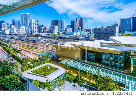 A new view of Tokyo's urban landscape in Japan. Views include Takanawa Gateway Station, the Shinkansen, the Yamanote Line, and the tower apartment complexes in Shibaura. 132225451