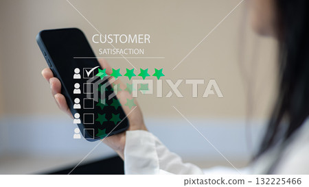 Customer Satisfaction and Online Review Concept with Smartphone and Rating Stars 132225466