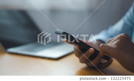 Business Communication and Mobile Working Concept with Smartphone and Laptop Business Communication and Mobile Working Concept with Smartphone and Laptop 132225475