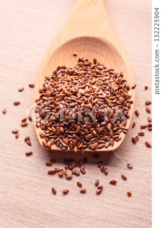 Flax seeds linseed on wooden spoon Flax seeds linseed on wooden spoon 132225904