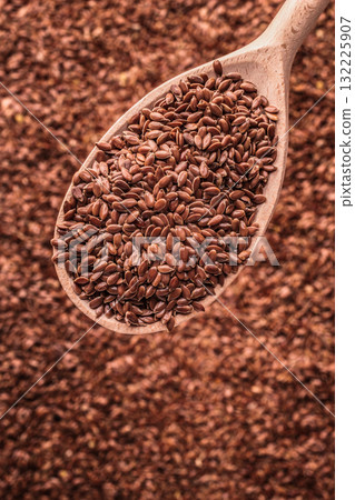 Flax seeds linseed on wooden spoon 132225907