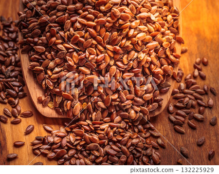 Flax seeds linseed on wooden spoon Flax seeds linseed on wooden spoon 132225929