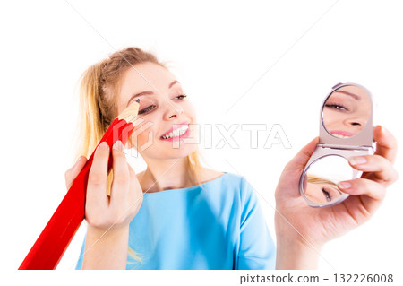 Woman painting eyebrows using regular pencil 132226008