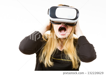 Woman wearing VR goggles Woman wearing VR goggles 132226629