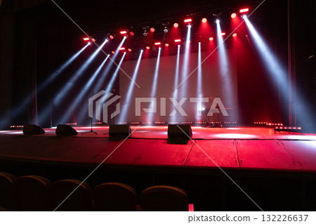 A spotlight on an empty stage. 132226637