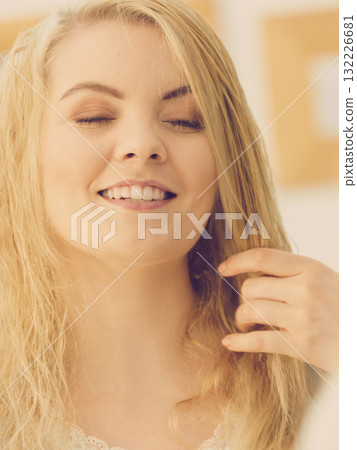 Woman with wet blonde hair Woman with wet blonde hair 132226681