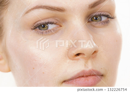 Girl with cream moisture cosmetic on face 132226754