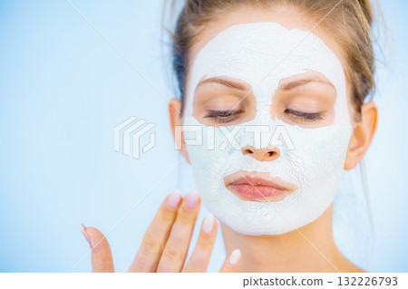 Girl with dry white mud mask on face 132226793