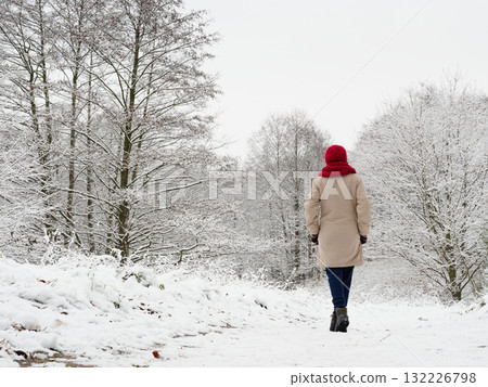 Woman walk in winter snow forest. 132226798