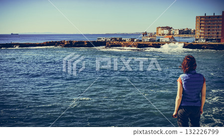 Tourist woman on sea cliffs in Spain Tourist woman on sea cliffs in Spain 132226799