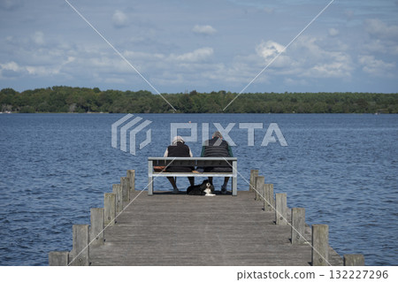 Elderly couple enjoying a peaceful moment at Lac de Leon in the Landes 132227296