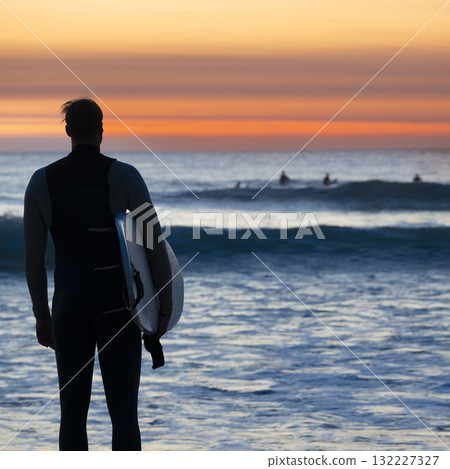 Surfer watching the sunset at Courant de Huchet in Departement des Landes 132227327