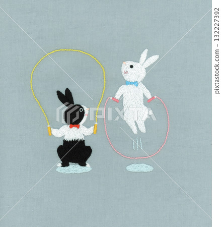 Embroidery of two rabbits skipping rope 132227392