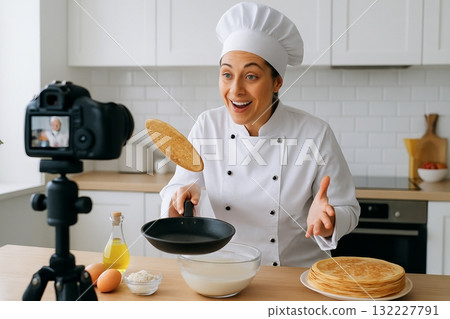 Chef hosts engaging culinary stream in modern kitchen with baking ingredients and camera. concept of cooking show, interactive meal preparation, online food content creation 132227791