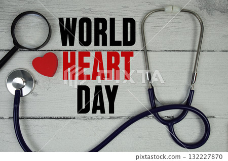 World Heart Day text with Red heart, Magnifying glass and Medical Stethoscope on wooden background World Heart Day text with Red heart, Magnifying glass and Medical Stethoscope on wooden background 132227870