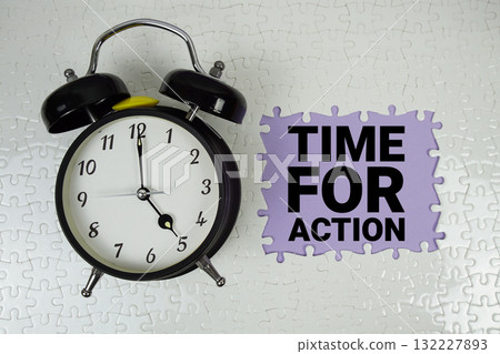 Time For Action text with alarm clock on purple background Time For Action text with alarm clock on purple background 132227893
