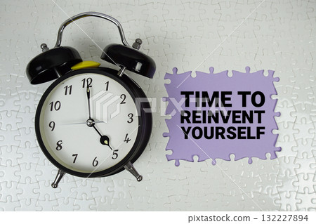 Time to Reinvent Yourself (TRY) text with alarm clock on purple background 132227894