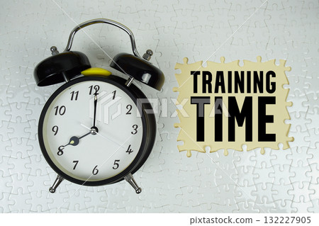 Training Time text with alarm clock on yellow background Training Time text with alarm clock on yellow background 132227905