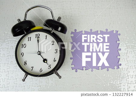 First Time Fix text with alarm clock on purple background 132227914