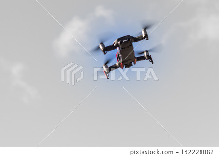 Drone flying over sky background 132228082