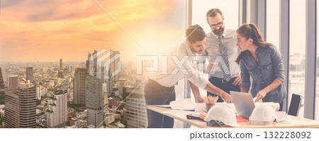Double exposure image of Engineers team meeting for architectural project during overlay with construction site in the city. Double exposure image of Engineers team meeting for architectural project during overlay with construction site in the city. 132228092